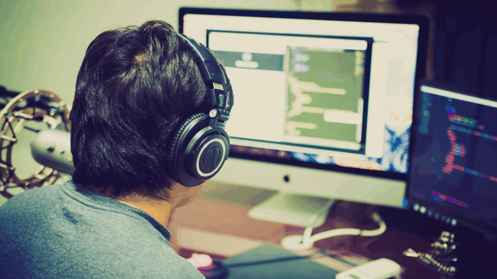 IT professional sitting at a computer, representing specialized tech talent available through IT staffing companies.