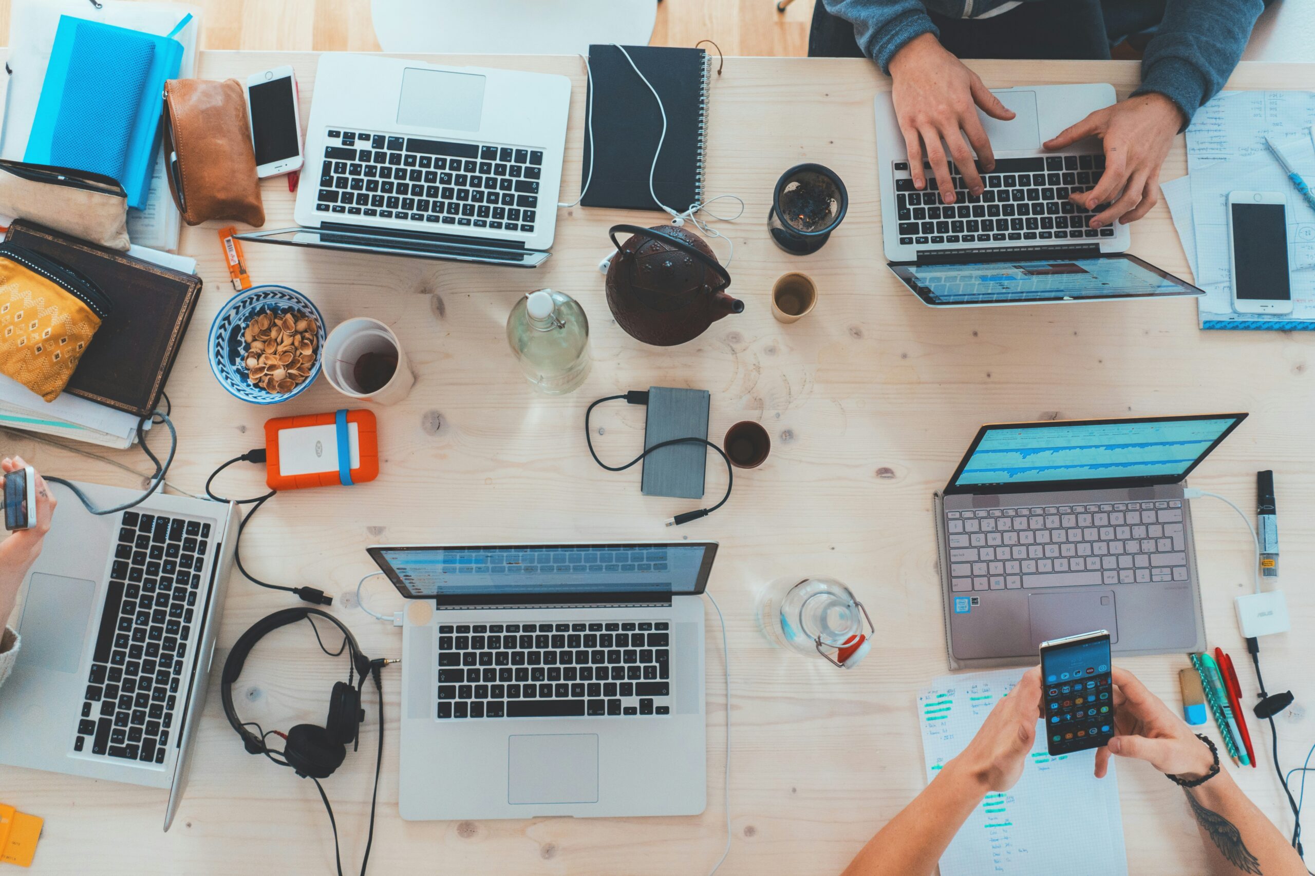 Small business team collaborating in a modern office, demonstrating how small businesses can compete with Big Tech for top talent through flexible and remote work environments.
